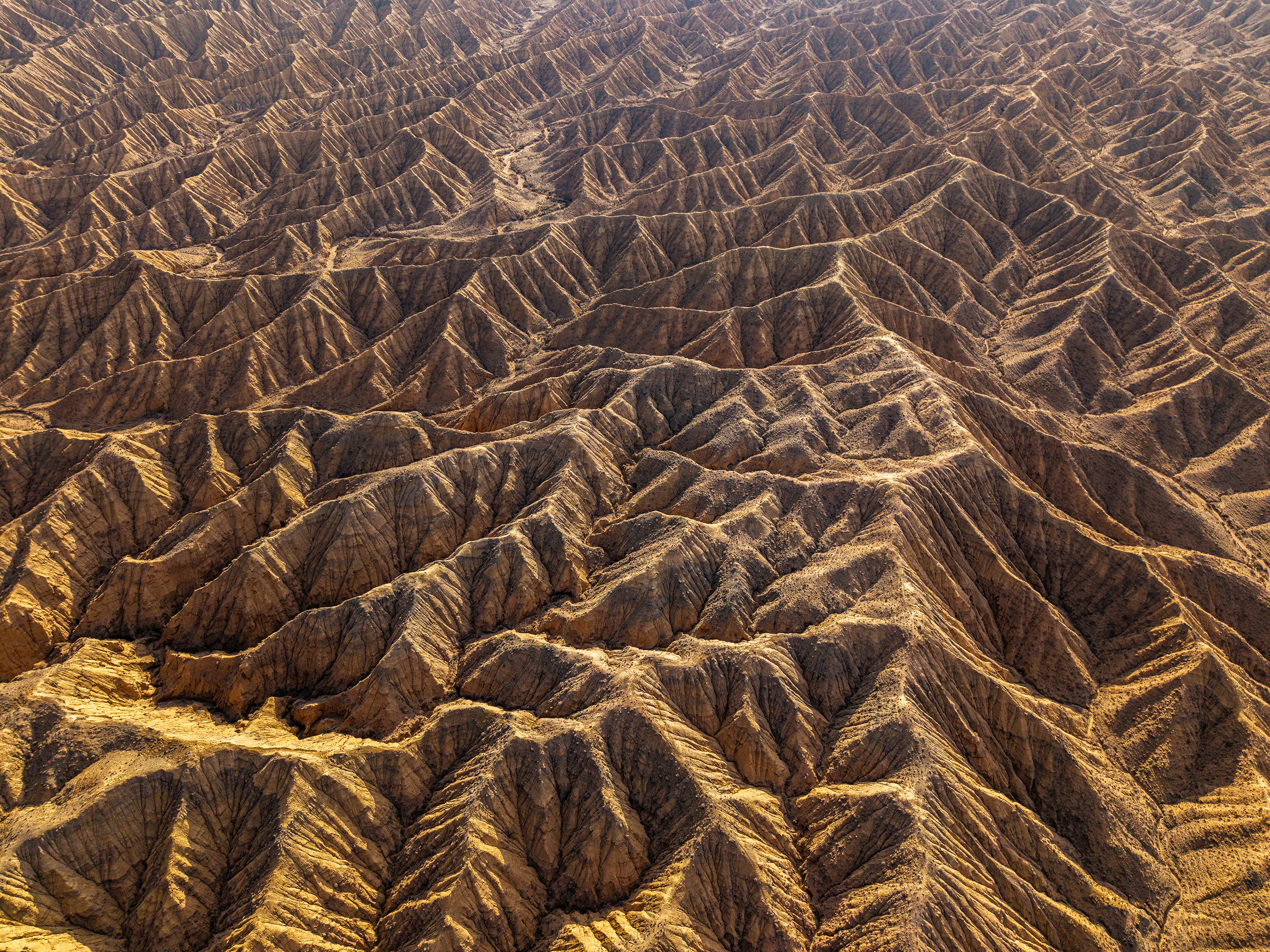 Kyrgyzstan — eroded badlands, aerial