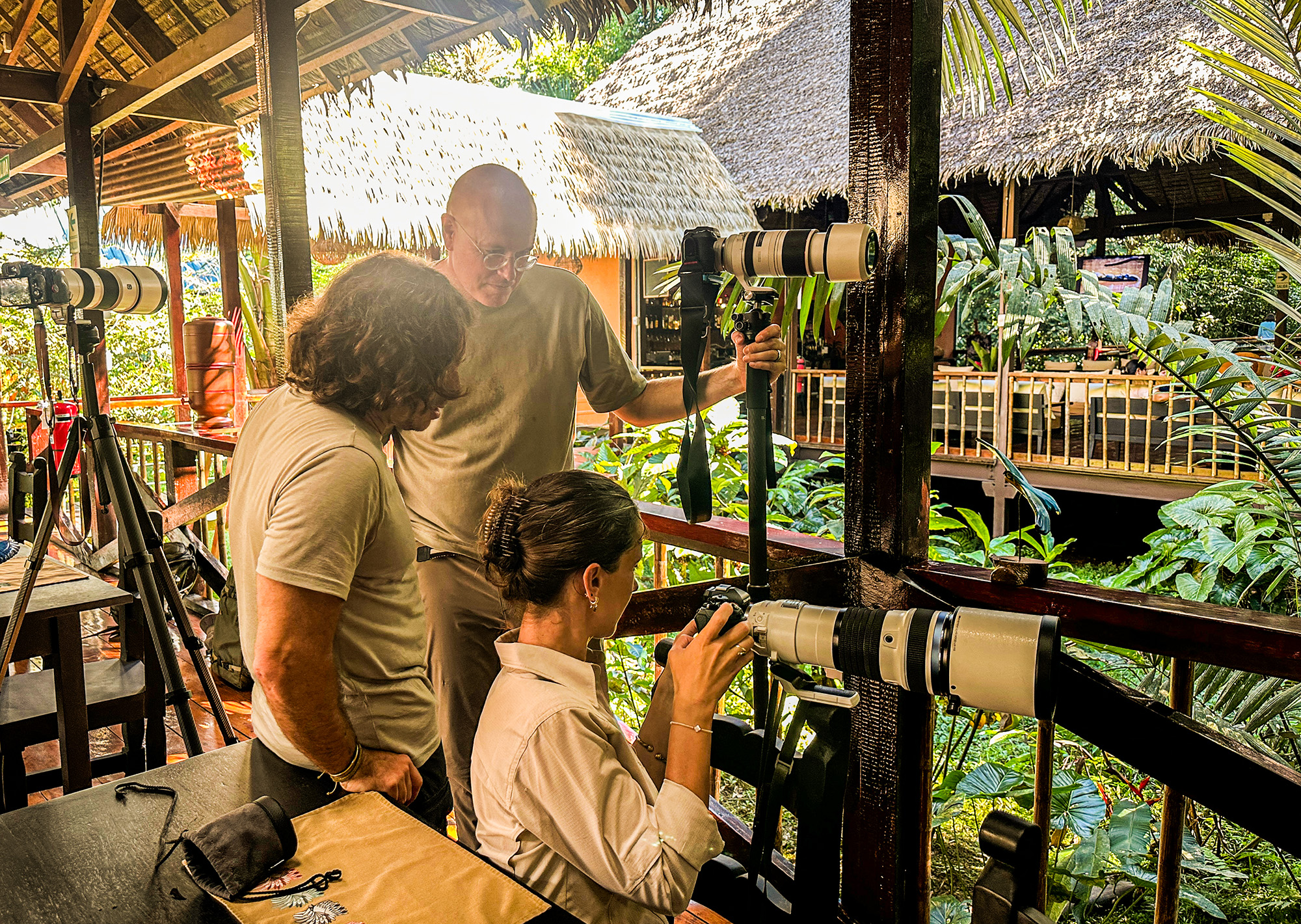 Guests reviewing shots with telephoto lenses at Tambopata Research Center
